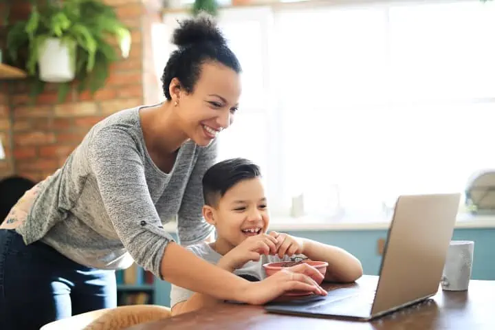 mother and son playing on a laptop